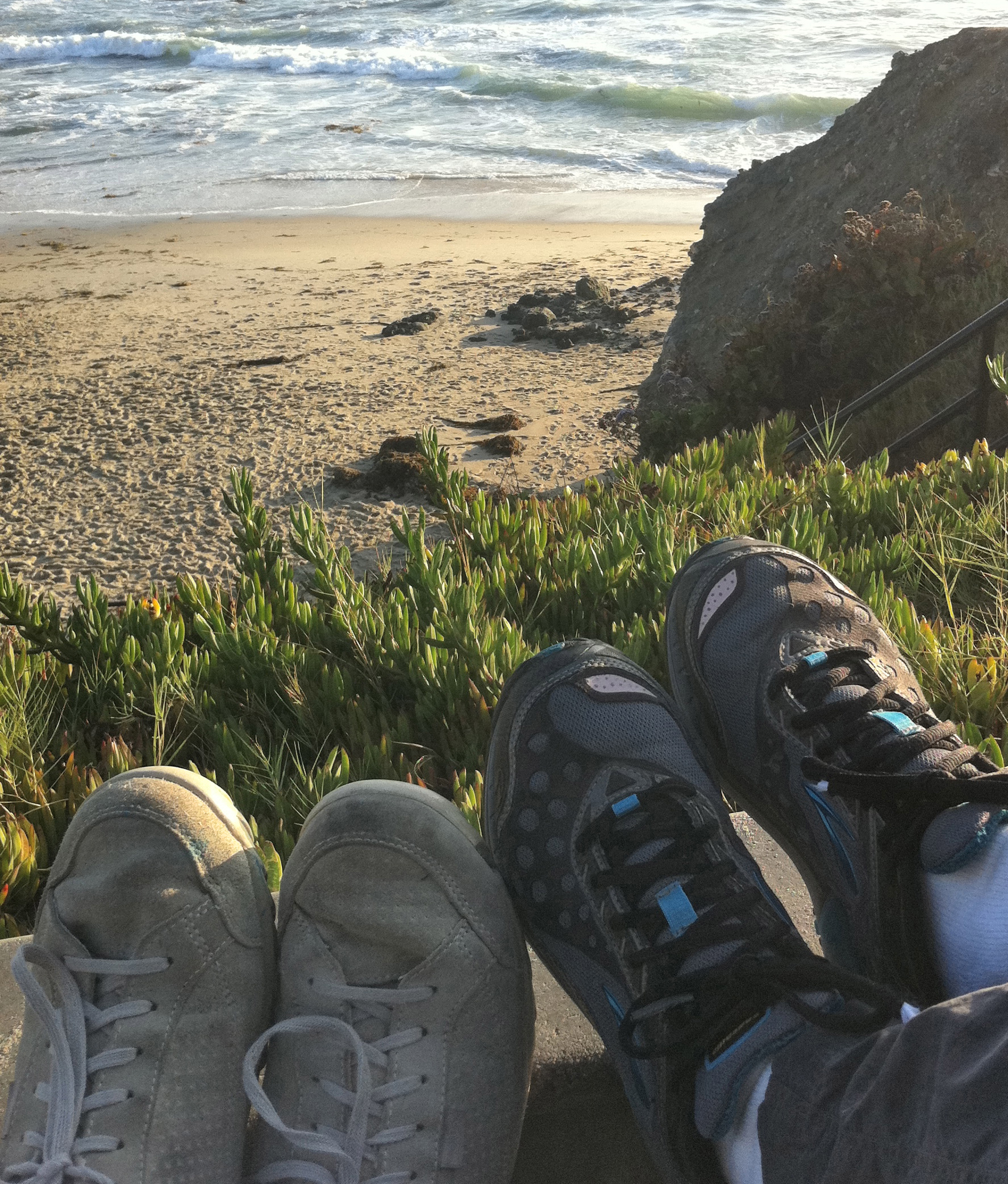 2 sets of shoes at beach